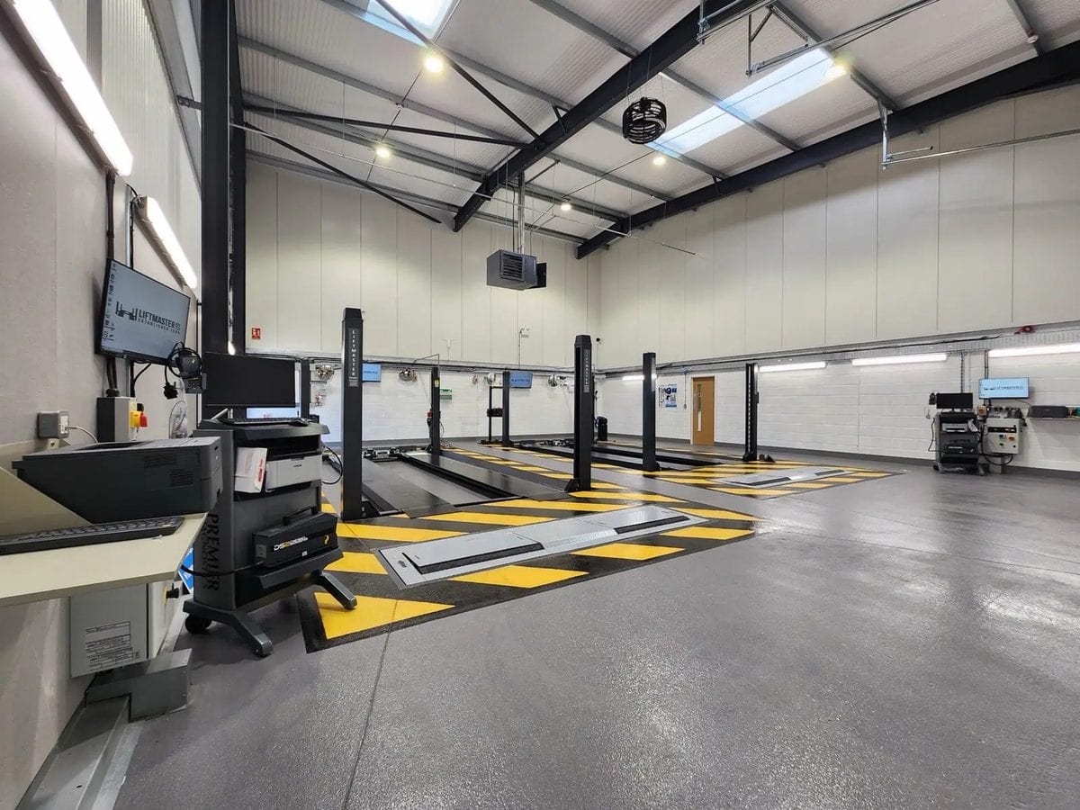 Liftmaster MOT bay installation, with vehicle lift, brake tester and headlamp tester in place