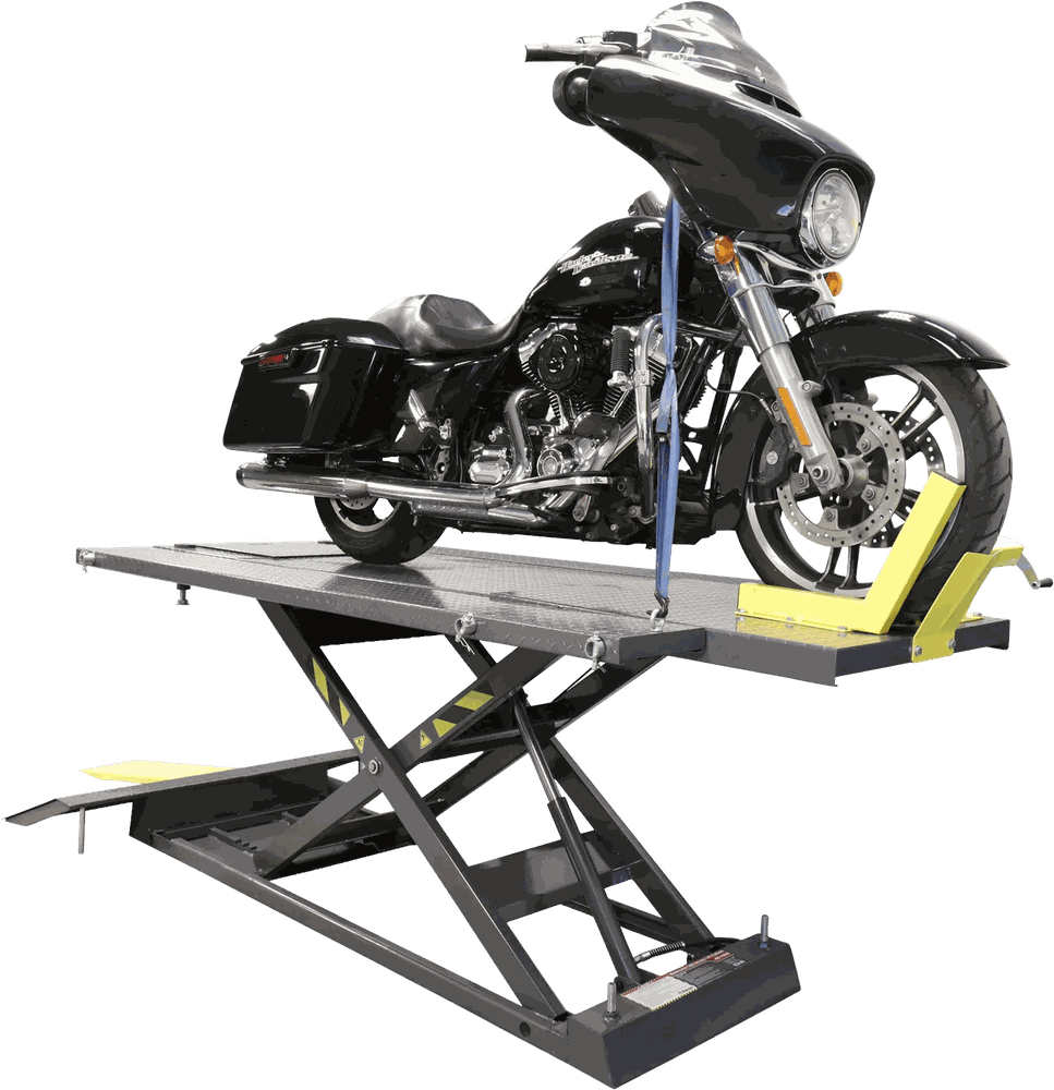 Motorcycle raised on a workshop lift in a service bay